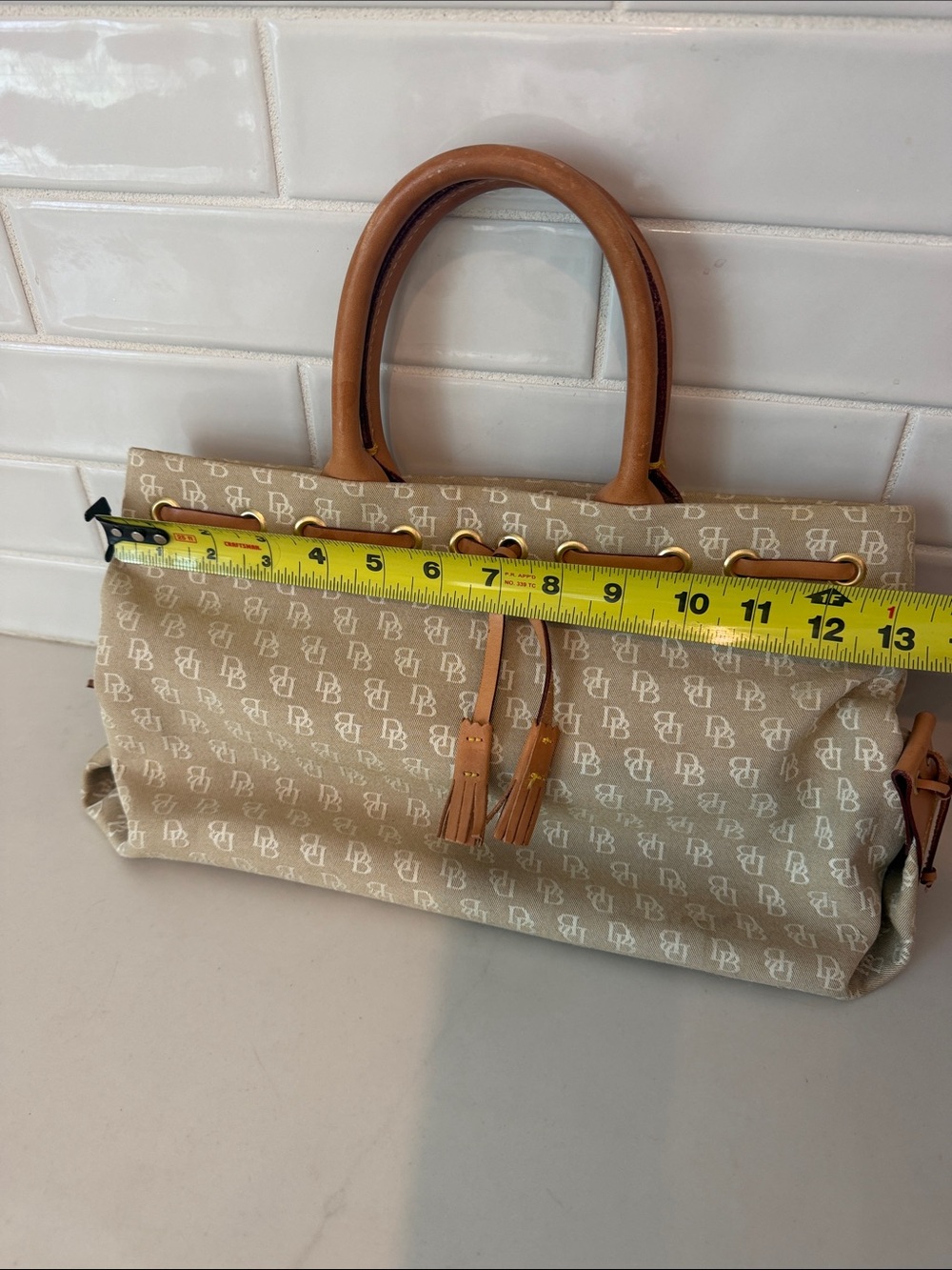 Dooney & Bourke tassel tote with brown leather handles - Picture 10 of 12